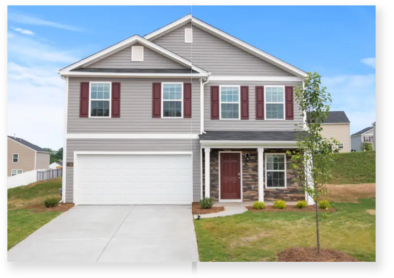 A house with a garage and driveway in front of it.